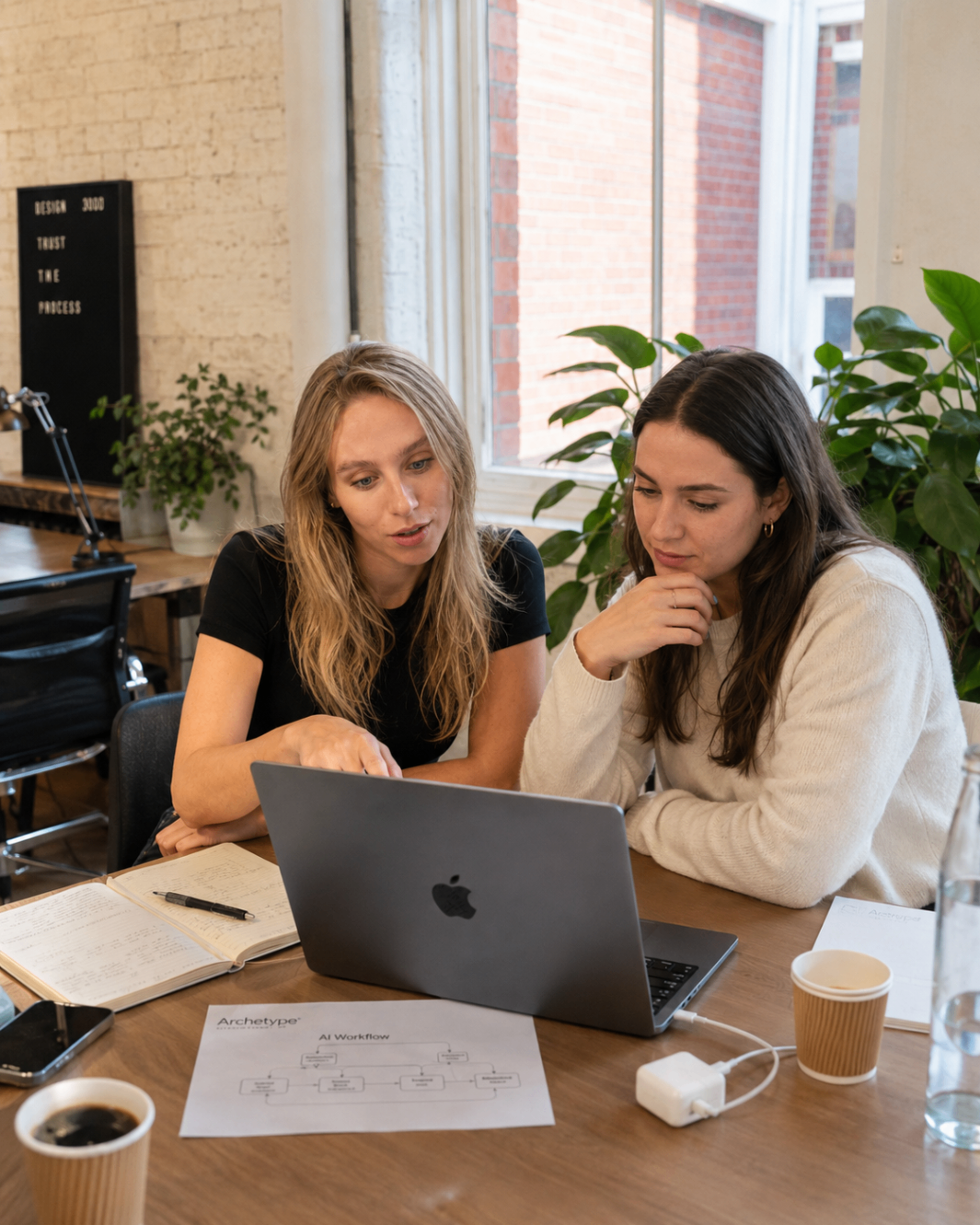 Harriet Bishop working one-to-one with a client on an Archetype AI workflow.