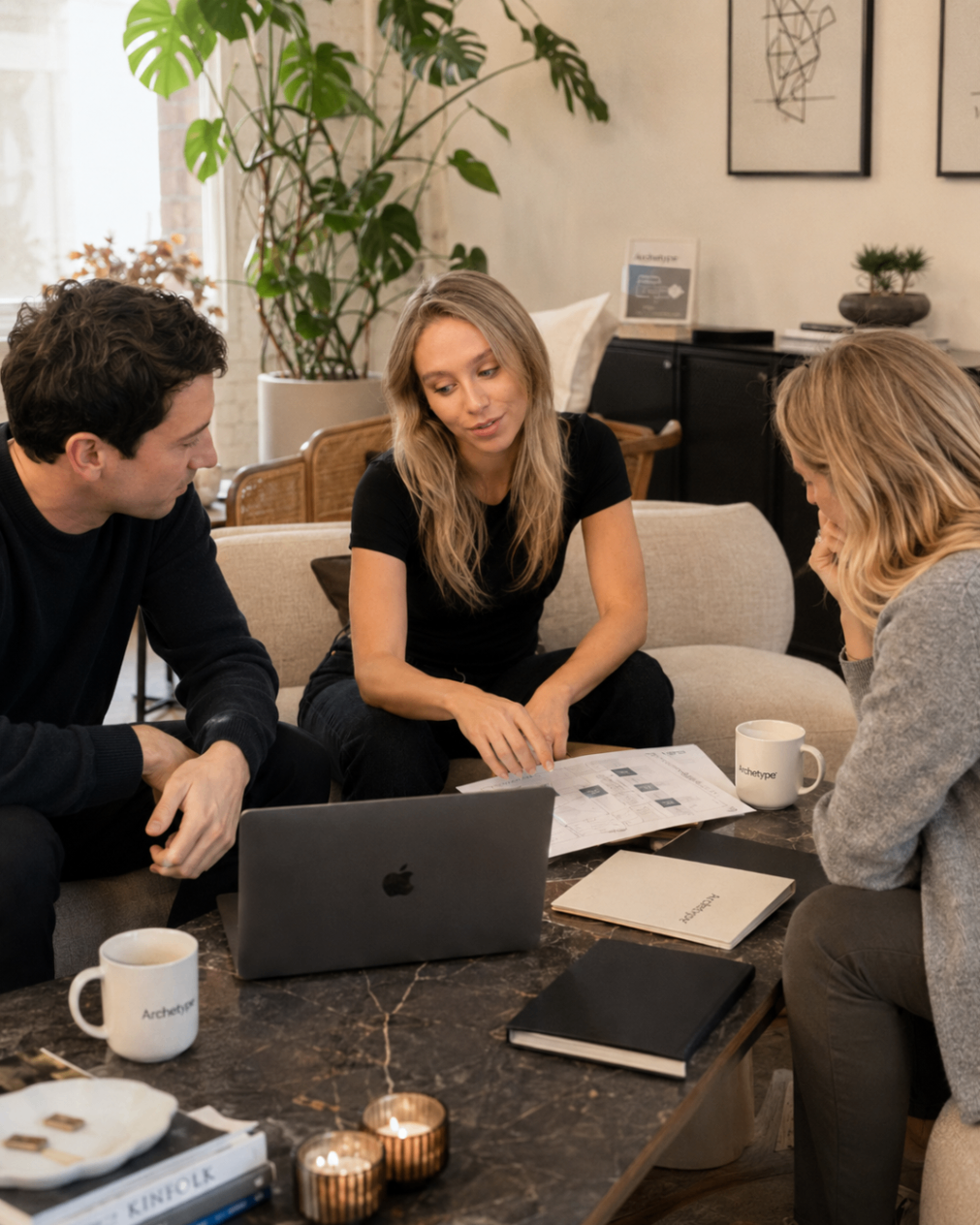 Harriet Bishop in a client conversation reviewing Archetype workflow documents.